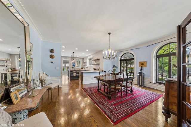 1141 N Ridgeland Ave, Oak Park, IL 60302 - dining room with a chandelier, dark wood-type flooring, wainscoting, and ornamental molding