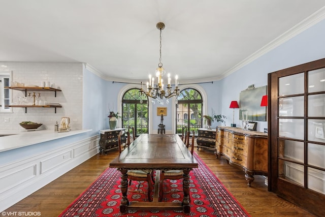 1141 N Ridgeland Ave, Oak Park, IL 60302 - dining space with a chandelier, ornamental molding, dark wood-style floors, and a wainscoted wall