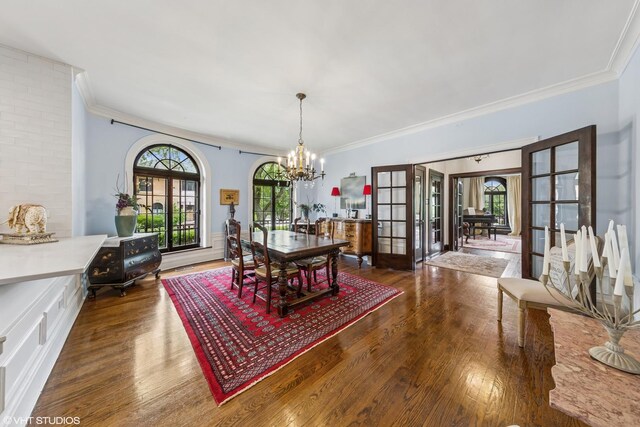 1141 N Ridgeland Ave, Oak Park, IL 60302 - dining area featuring french doors, a chandelier, crown molding, and wood finished floors