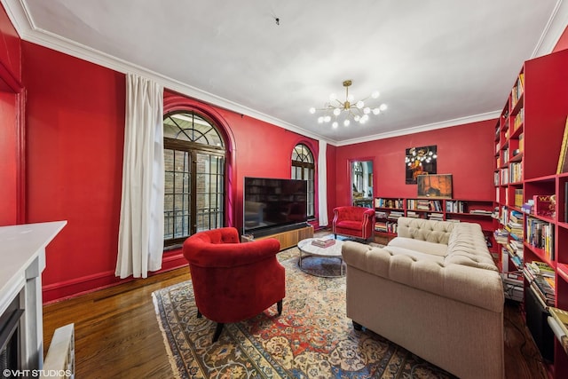 1141 N Ridgeland Ave, Oak Park, IL 60302 - living room featuring a chandelier, crown molding, wood finished floors, baseboards, and a fireplace with flush hearth