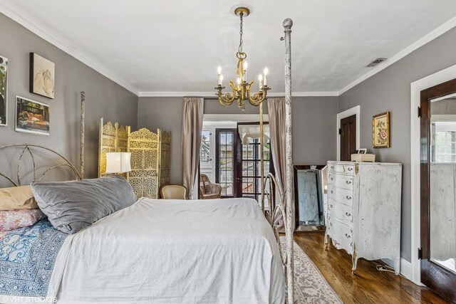 1141 N Ridgeland Ave, Oak Park, IL 60302 - bedroom with a chandelier, dark wood-style floors, and ornamental molding