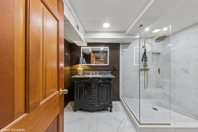 1141 N Ridgeland Ave, Oak Park, IL 60302 - bathroom with a marble finish shower, vanity, marble look tile flooring, and recessed lighting