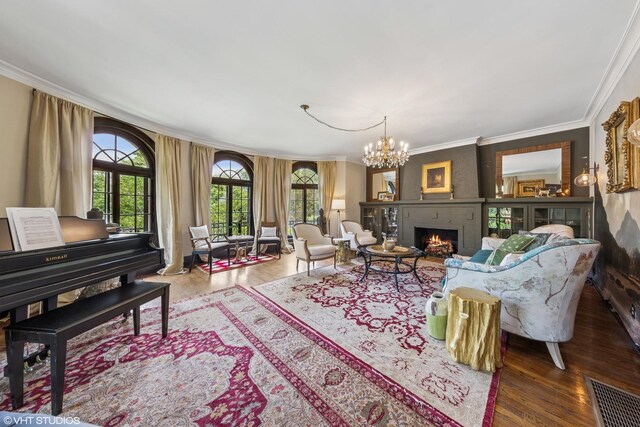 1141 N Ridgeland Ave, Oak Park, IL 60302 - living area with a chandelier, a fireplace, ornamental molding, and wood finished floors