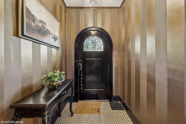 1141 N Ridgeland Ave, Oak Park, IL 60302 - entryway featuring baseboards, wallpapered walls, and ornamental molding