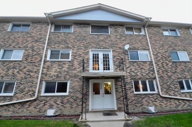 5848 W 76th Pl Unit 202, Burbank, IL 60459 - view of front of home featuring brick siding and french doors
