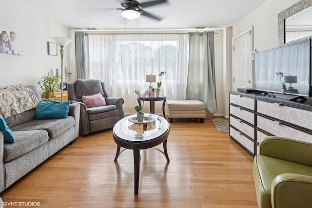 1140 W Barry Ave, Chicago, IL 60657 - living area with ceiling fan and light wood finished floors