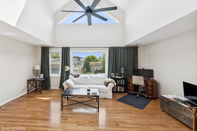 1140 W Barry Ave, Chicago, IL 60657 - living area with ceiling fan, light wood-style floors, high vaulted ceiling, and a desk