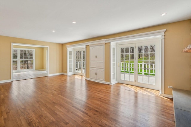 21956 N Hickory Hill Dr, Kildeer, IL 60047 - unfurnished living room with wood finished floors, baseboards, and recessed lighting