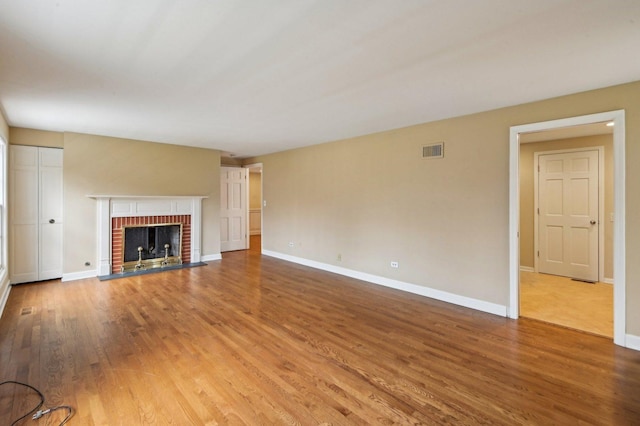 21956 N Hickory Hill Dr, Kildeer, IL 60047 - unfurnished living room with wood finished floors, a fireplace, and baseboards