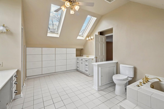 21956 N Hickory Hill Dr, Kildeer, IL 60047 - bathroom featuring lofted ceiling, vanity, a skylight, a ceiling fan, and a bath