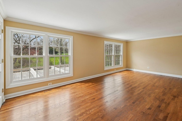 21956 N Hickory Hill Dr, Kildeer, IL 60047 - spare room featuring ornamental molding, plenty of natural light, baseboards, and wood finished floors