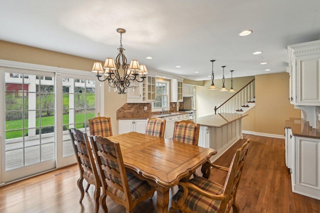 21956 N Hickory Hill Dr, Kildeer, IL 60047 - dining area with a chandelier, baseboards, wood finished floors, stairs, and recessed lighting