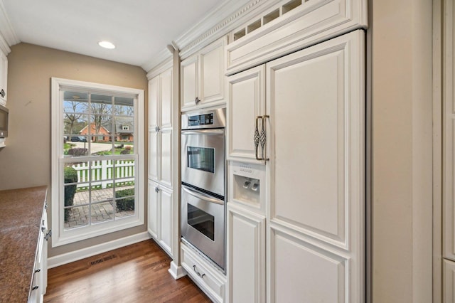 21956 N Hickory Hill Dr, Kildeer, IL 60047 - kitchen featuring double oven, recessed lighting, healthy amount of natural light, dark wood-style floors, and white cabinets