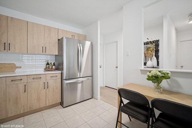 211 E Ohio St Unit 2819, Chicago, IL 60611 - kitchen with freestanding refrigerator, light brown cabinetry, light countertops, and light tile patterned flooring