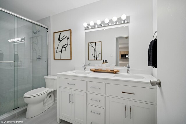 211 E Ohio St Unit 2819, Chicago, IL 60611 - bathroom with toilet, double vanity, a stall shower, and tile patterned flooring