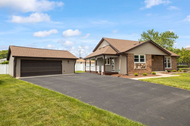 16906 Grissom Dr, Tinley Park, IL 60477 - view of front of property with an outdoor structure, a garage, brick siding, and a shingled roof