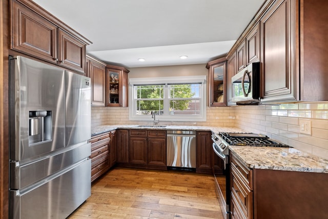 16906 Grissom Dr, Tinley Park, IL 60477 - kitchen with appliances with stainless steel finishes, a sink, light wood-type flooring, light stone countertops, and recessed lighting