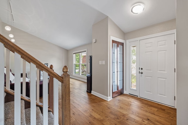 16906 Grissom Dr, Tinley Park, IL 60477 - entryway featuring vaulted ceiling, wood-type flooring, baseboards, and stairway