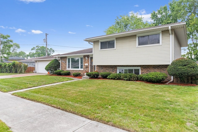 15240 Woodlawn Ave, Dolton, IL 60419 - split level home featuring a front lawn, driveway, a garage, and brick siding