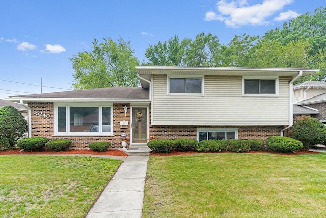 15240 Woodlawn Ave, Dolton, IL 60419 - tri-level home with a front lawn and brick siding