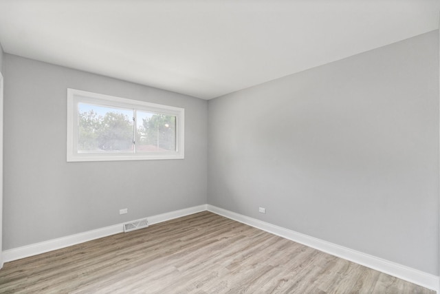 15240 Woodlawn Ave, Dolton, IL 60419 - spare room with light wood-style flooring and baseboards