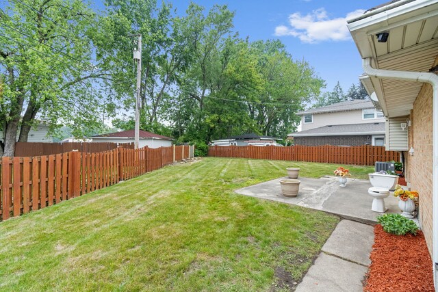 15240 Woodlawn Ave, Dolton, IL 60419 - view of yard featuring a patio and central air condition unit