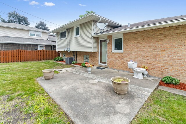 15240 Woodlawn Ave, Dolton, IL 60419 - back of house featuring central air condition unit, a patio, and brick siding
