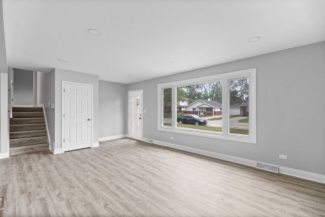 15240 Woodlawn Ave, Dolton, IL 60419 - unfurnished living room featuring wood finished floors, baseboards, and stairs
