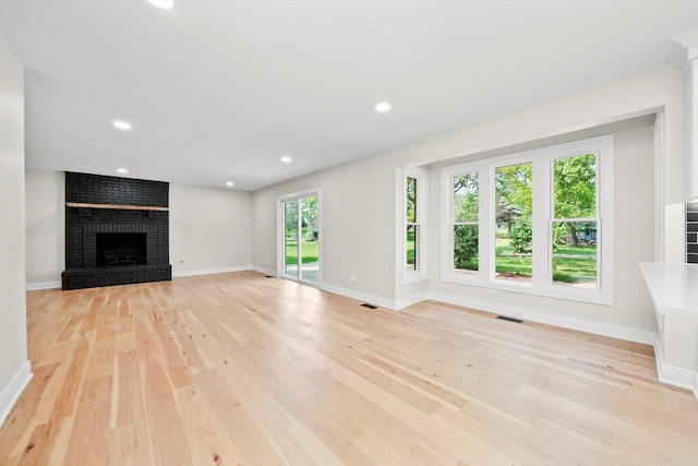 14814 Oakcreek Ct, Orland Park, IL 60467 - unfurnished living room with a fireplace, light wood-type flooring, and recessed lighting