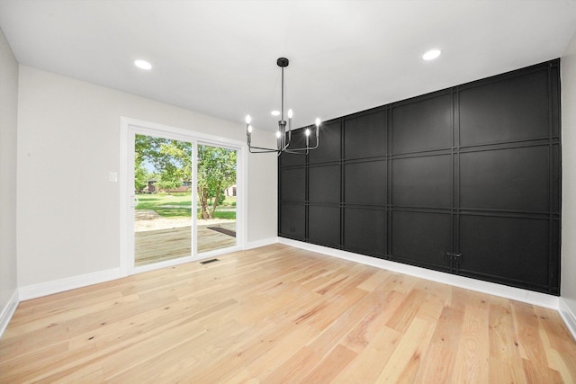 14814 Oakcreek Ct, Orland Park, IL 60467 - empty room featuring a chandelier, light wood-type flooring, a decorative wall, and recessed lighting