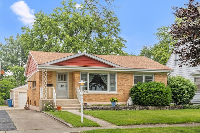 493 W Avery St, Elmhurst, IL 60126 - view of front of home featuring brick siding, roof with shingles, a front yard, and an outdoor structure