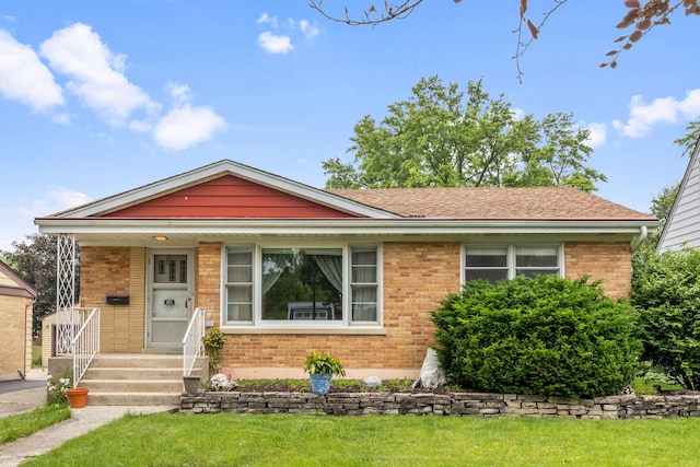 493 W Avery St, Elmhurst, IL 60126 - view of front of property with brick siding, a front lawn, and a porch