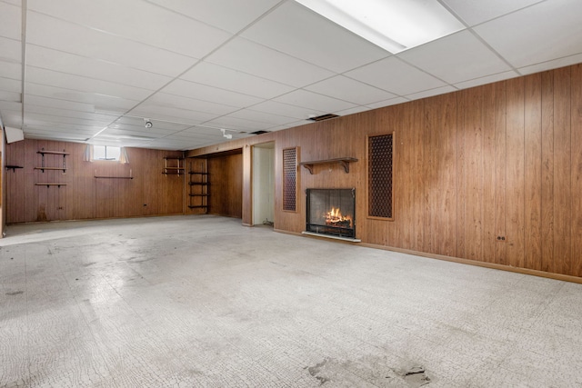 493 W Avery St, Elmhurst, IL 60126 - below grade area with wooden walls, a lit fireplace, and a drop ceiling