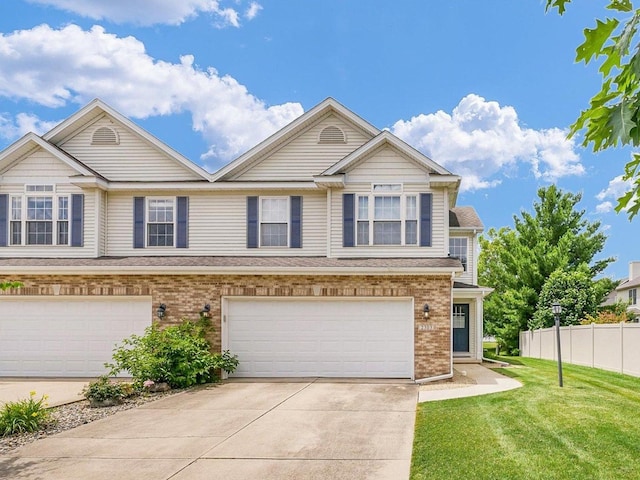 2303 Blanche Ln Unit B, Champaign, IL 61822 - view of front facade featuring concrete driveway, an attached garage, and brick siding