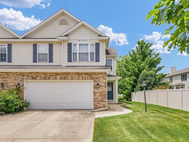 2303 Blanche Ln Unit B, Champaign, IL 61822 - view of front of home featuring brick siding, concrete driveway, and a garage
