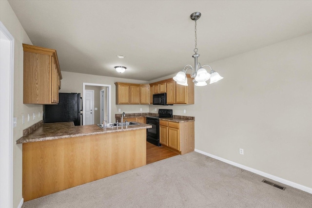 2303 Blanche Ln Unit B, Champaign, IL 61822 - kitchen featuring black appliances, a peninsula, a chandelier, pendant lighting, and light colored carpet