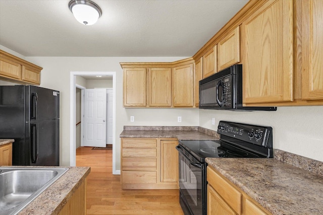 2303 Blanche Ln Unit B, Champaign, IL 61822 - kitchen featuring black appliances, light wood finished floors, and light brown cabinetry