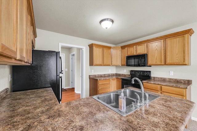 2303 Blanche Ln Unit B, Champaign, IL 61822 - kitchen featuring black appliances, a peninsula, and wood finished floors