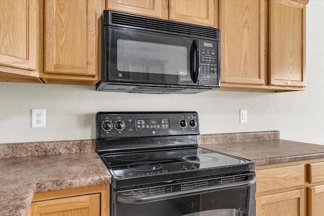 2303 Blanche Ln Unit B, Champaign, IL 61822 - kitchen with black appliances and light brown cabinetry