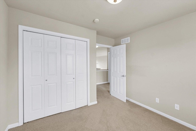 2303 Blanche Ln Unit B, Champaign, IL 61822 - unfurnished bedroom featuring light colored carpet and a closet