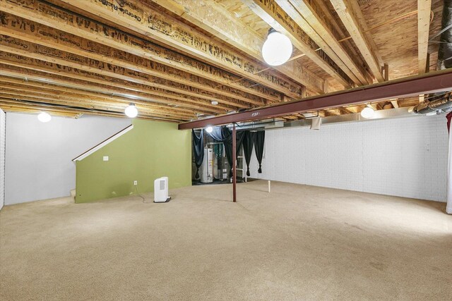 2303 Blanche Ln Unit B, Champaign, IL 61822 - below grade area featuring gas water heater and carpet flooring