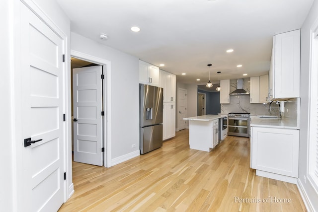 631 S Whispering Hills Dr, Naperville, IL 60540 - kitchen featuring stainless steel appliances, wall chimney range hood, a kitchen island, light countertops, and recessed lighting
