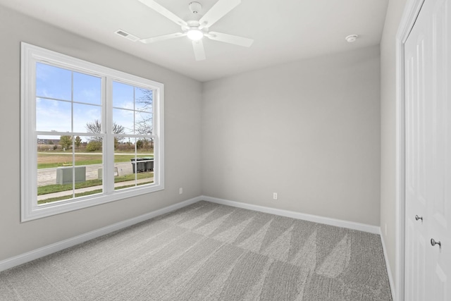 6375 Jasmine Ave, Portage, IN 46368 - carpeted spare room with baseboards, a ceiling fan, and a smoke detector