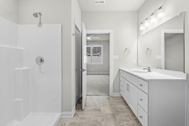 6375 Jasmine Ave, Portage, IN 46368 - full bath featuring marble look tile flooring, vanity, baseboards, and a shower