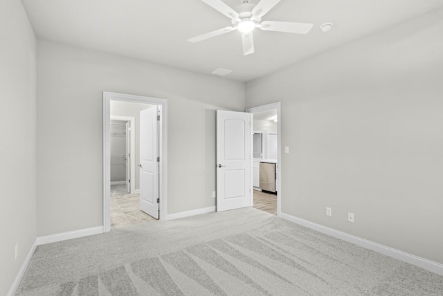 6375 Jasmine Ave, Portage, IN 46368 - unfurnished bedroom featuring a spacious closet, light colored carpet, baseboards, a ceiling fan, and a closet