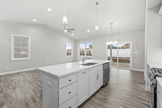 6375 Jasmine Ave, Portage, IN 46368 - kitchen featuring a sink, appliances with stainless steel finishes, vaulted ceiling, a ceiling fan, and light wood-style floors
