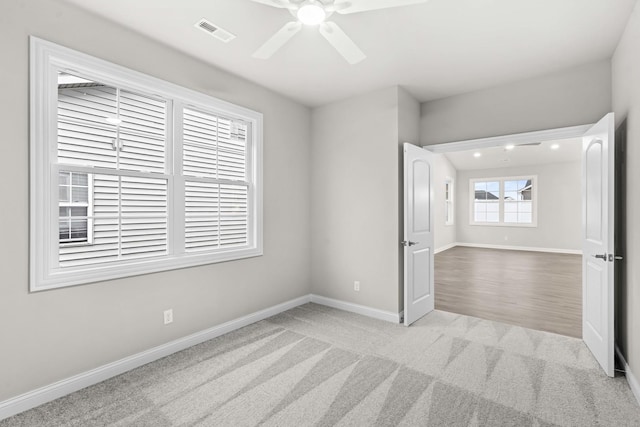 6375 Jasmine Ave, Portage, IN 46368 - spare room featuring baseboards, a ceiling fan, and carpet
