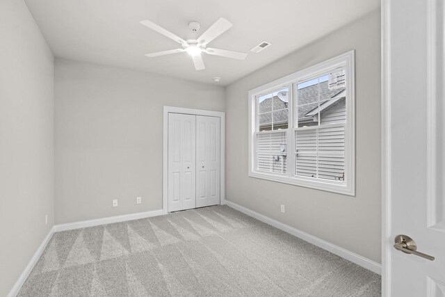 6375 Jasmine Ave, Portage, IN 46368 - unfurnished bedroom featuring light carpet, baseboards, a closet, and a ceiling fan