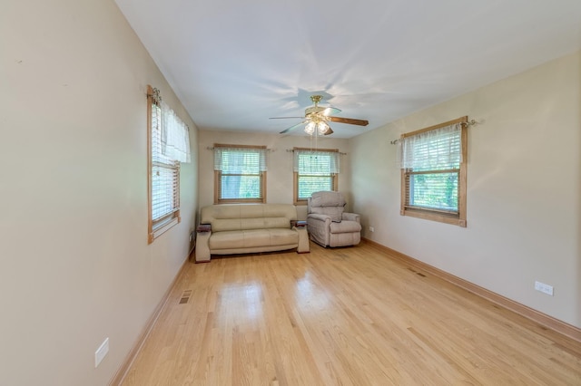 1825 W Sherry Ln, Addison, IL 60101 - living area featuring light wood-style flooring, ceiling fan, and baseboards
