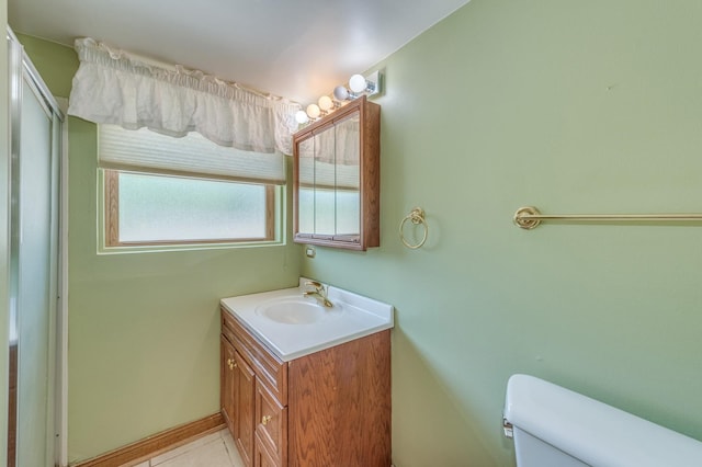 1825 W Sherry Ln, Addison, IL 60101 - bathroom featuring toilet, vanity, tile patterned flooring, and baseboards